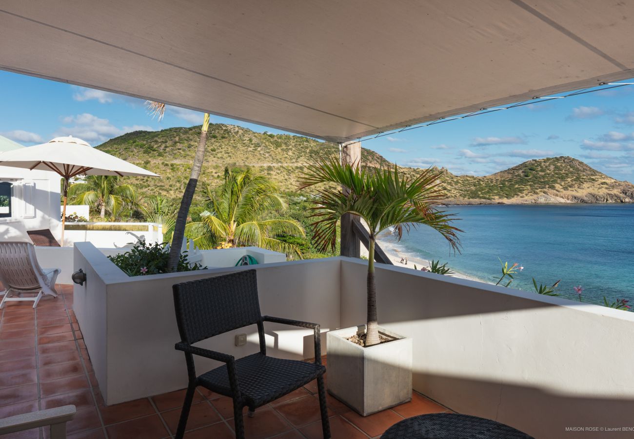 Terrace salon's bedroom with sea view. Terrace off the living room at Villa Maison Rose Toiny in St Barths with a lovely view of the Caribbean Sea